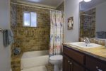 Guest en-suite bathroom with tub/shower combo